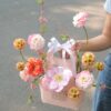 Túi hoa quà tặng mix tulip thược dược tú cầu nhỏ tone hồng cam